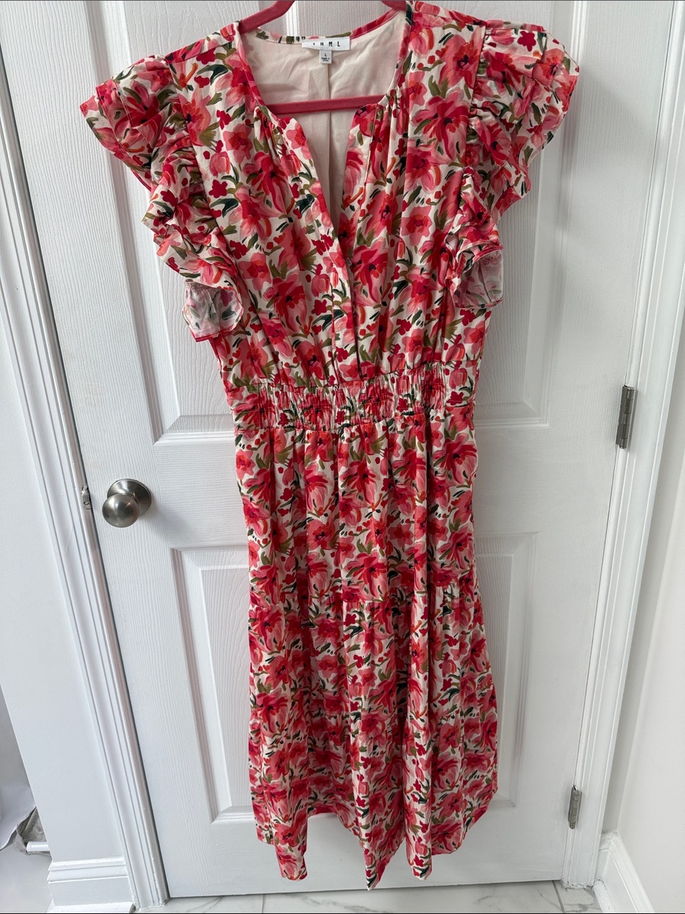 THML Coral and green flower dress with ruffle sleeves and ruched waist.